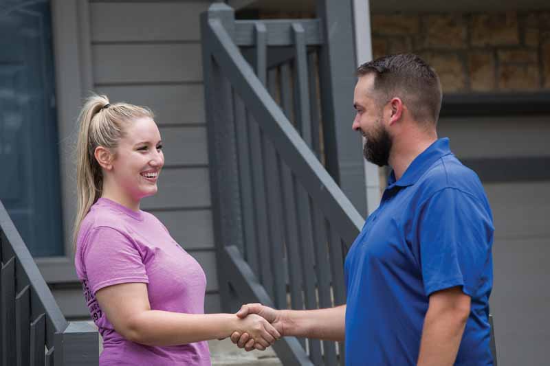 dealer greeting customer